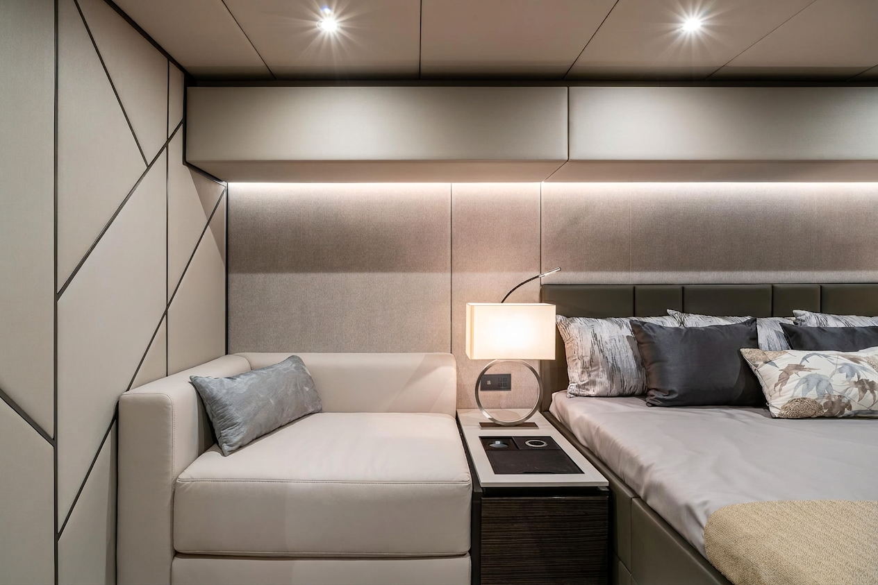Guest cabin with upholstered walls and reading lights